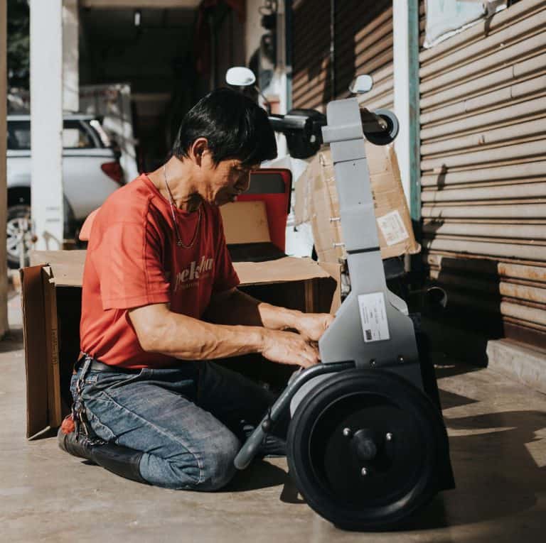 An engineer is performing repairs on a cleaning equipment.