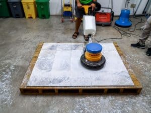 Demonstration of floor scrubber on tile