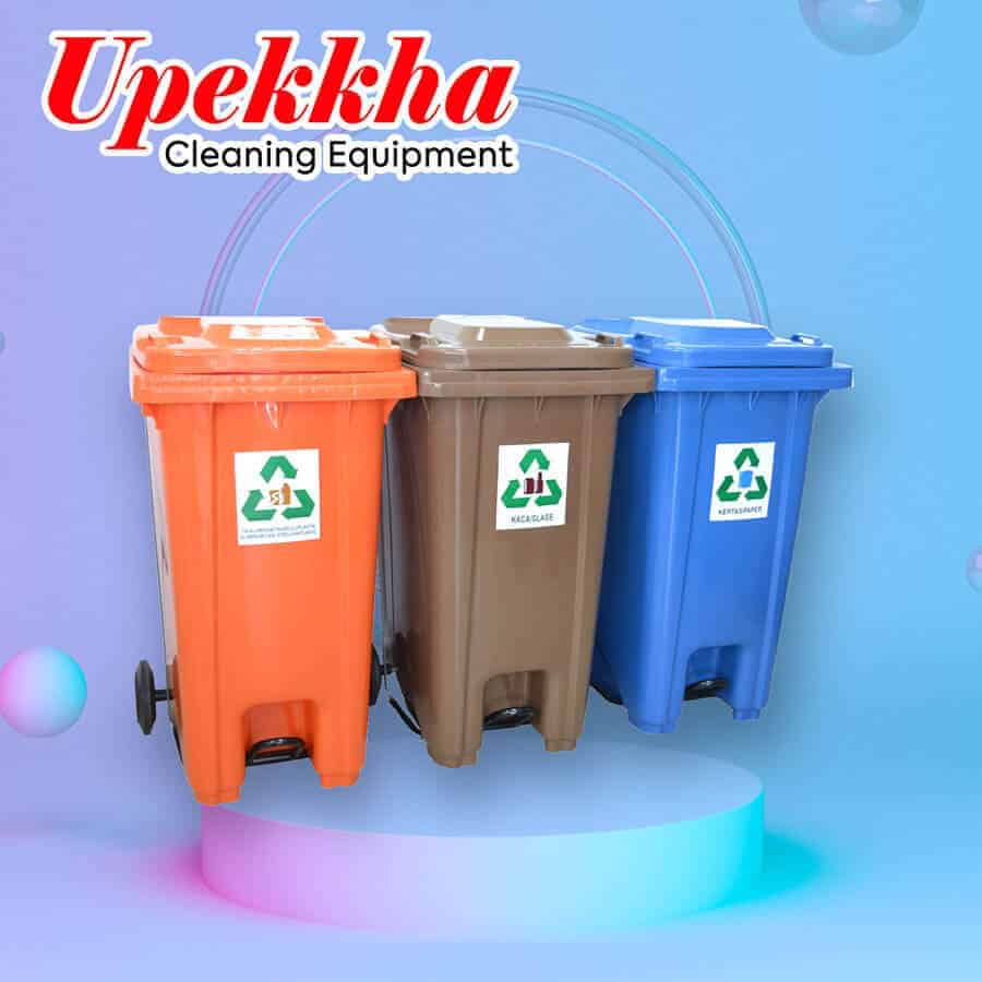 Upekkha orange, brown and blue rectangular polyethylene recycle bins with foot pedal.