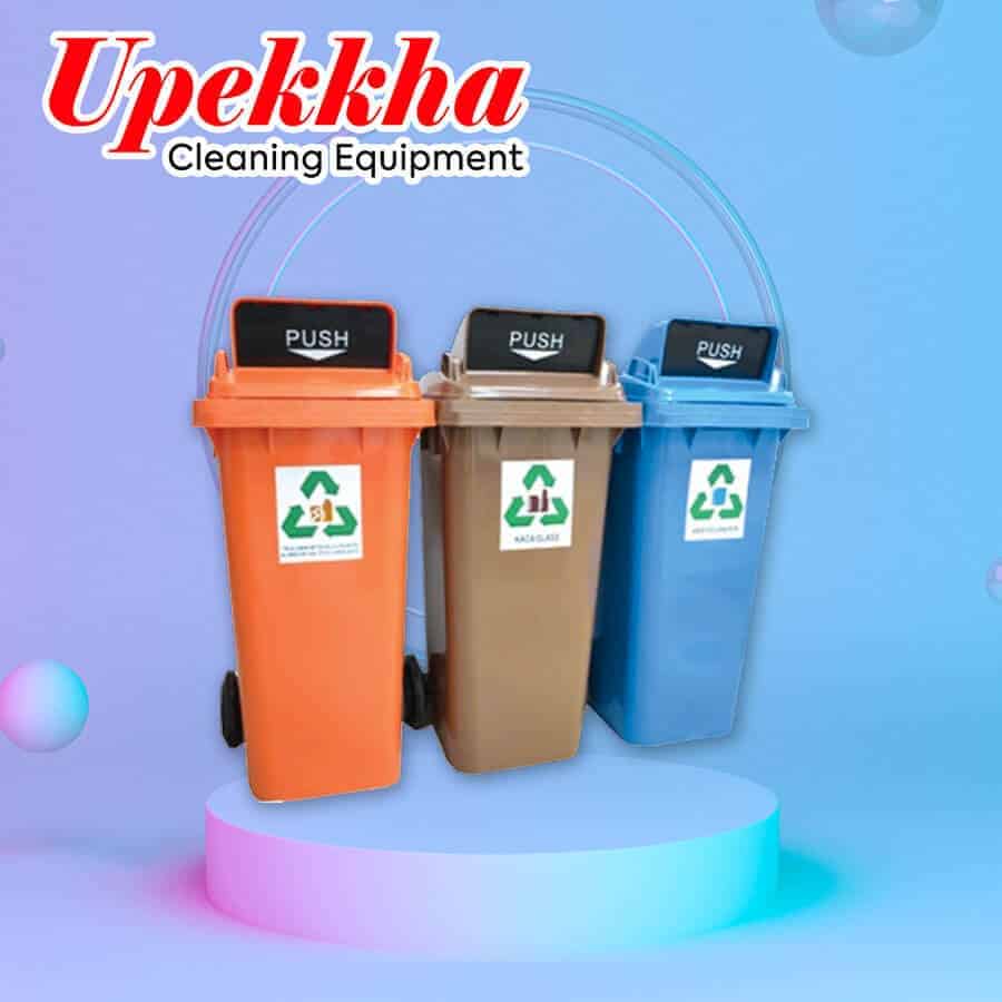 Three Upekkha polyethylene flip top recycle bin in colors orange, grey and blue.