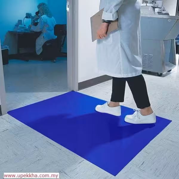A person was walking on blue sticky mat with shoes on