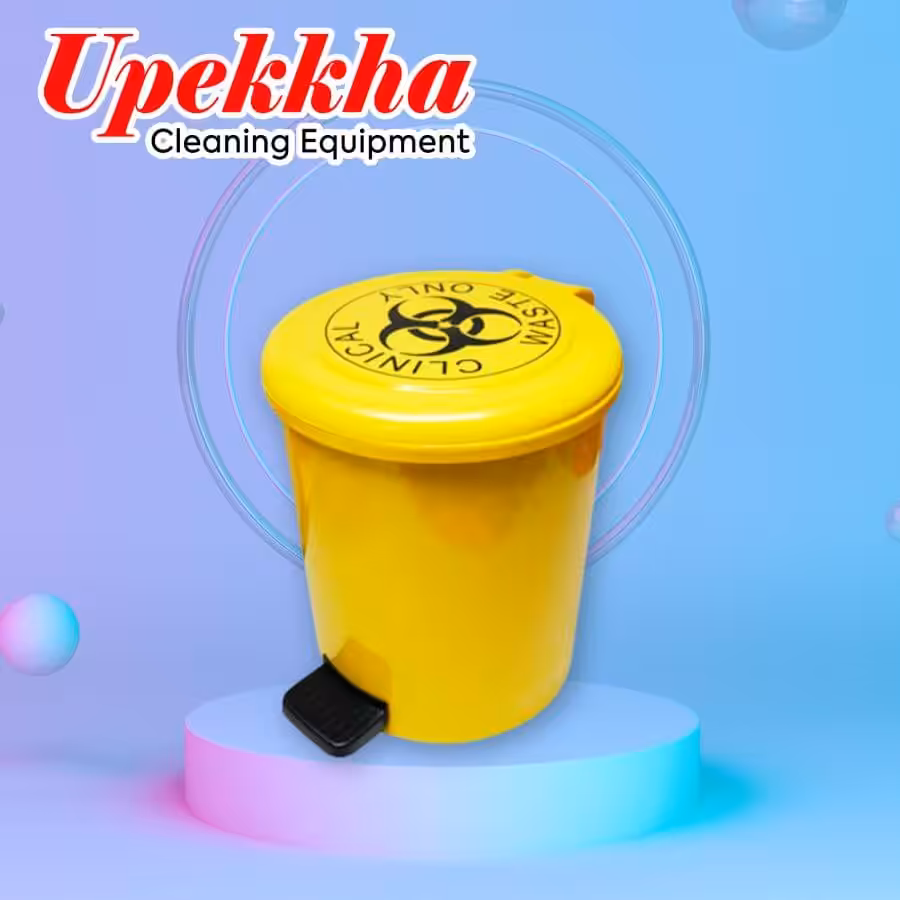 Yellow medical waste disposal bin with foot pedal for hygienic waste management.