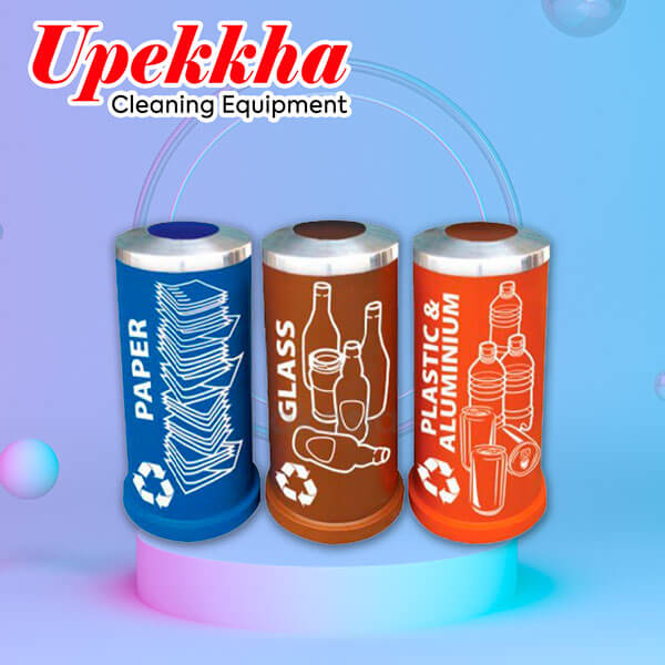 Three cylindrical polyethylene recycle bins with open top for paper, glass and plastic and aluminium